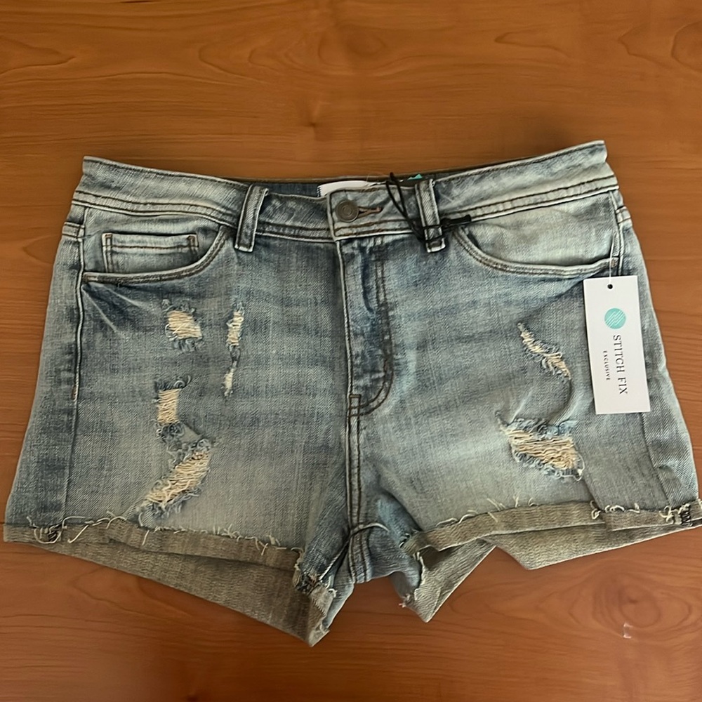 Studio Blue medium light blue distressed jean shorts Size 29. NWT